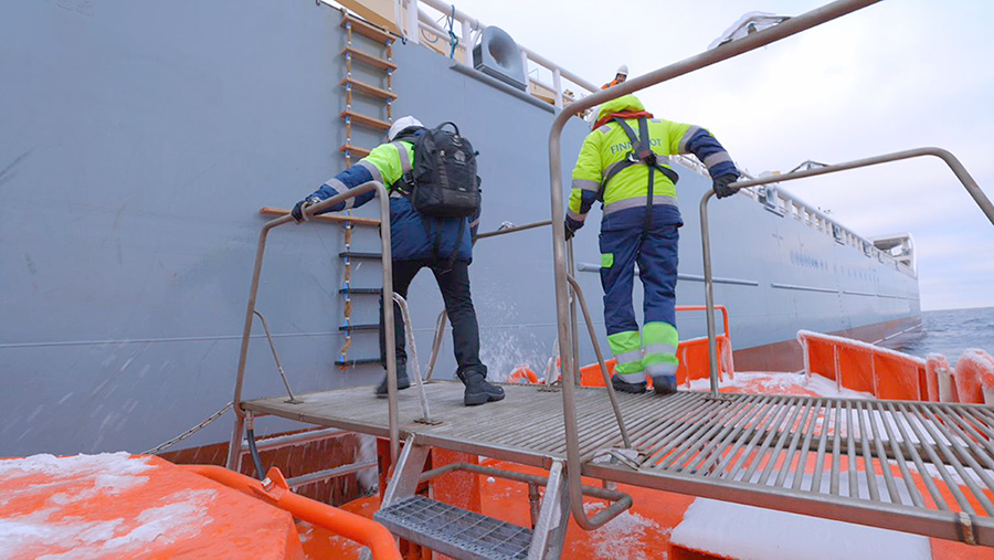 Two pilots boarding vessel.