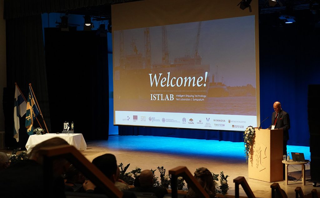 Man giving a speech on stage.